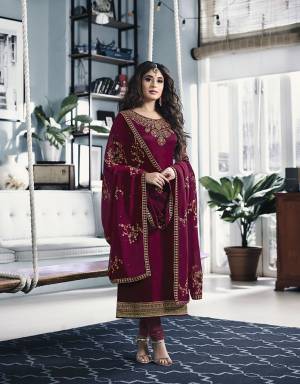 Catch All The Lime Light Wearing This Attractive Looking Designer Straight Cut Suit In Magenta Pink Color. Its Top Is Fabricated On Satin Georgette Paired With Santoon Bottom And Heavy Embroidered Georgette Fabricated Dupatta. 