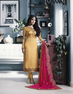 Celebrate This Festive And Wedding With Beauty And Comfort Wearing This Heavy Designer Straight Cut Suit In Musturd Yellow Color Paired With Contrasting Rani Pink Colored Dupatta. Its Top IS Satin Georgette Based Paired With Santoon Bottom And Georgette Fabricated Cut Work Dupatta. 