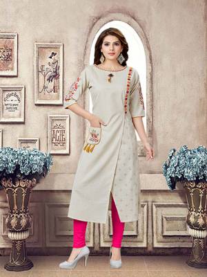 Here Is An Amazing Designer Patternred Readymade Kurti In Cream Color. This Pretty Kurti Is Cotton Based Beautified With Multi Colored Thread Work. Buy Now.