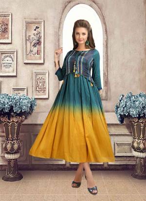 New And Unique Look Is Available Here With This Designer Readymade Kurti In Prussian Blue And Yellow Color. This Kurti Is Fabricated On Linen Which Is Light Weight And Easy To Carry All Day Long. 