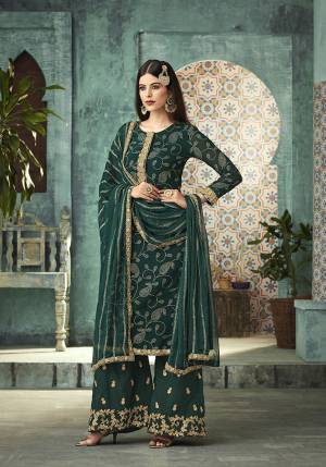 New Shade Is Here To Add Into Your Wardrobe With This Designer Plazzo Suit In Pine Green Color Beautified With Attractive Foil Prints And Heavy Embroidery Work. Its Top Is Fabricated On Georgette paired With Santoon Bottom And Chiffon Fabricated Dupatta. 