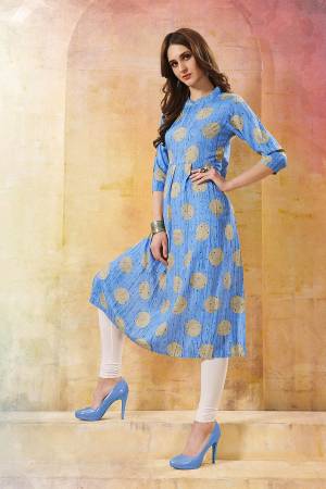For your Casual Wear, Grab This Readymade Kurti In Sky Blue Color Fabricated On Rayon. This Kurti Is Beautified With Prints And Also It IS Light In Weight. 