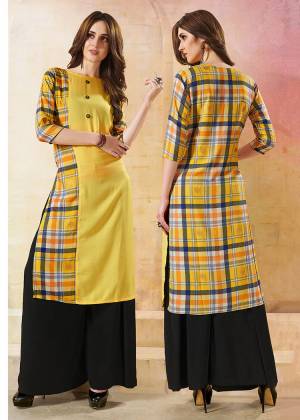Grab This Checkered Readymade Kurti In Yellow Color Fabricated On Rayon. This Kurti Is Beautified With Checks Prints Over The Back And Half Front. 