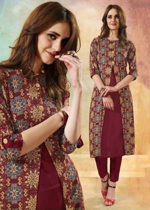 New Patterned Readymade Kurti Is Here In Maroon Color Fabricated On Rayon. This Kurti Is Beautified With Pretty Prints And It IS Easy To Carry All Day Long. 