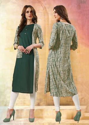 Formal Looking Readymade Kurti Is Here In Dark Green And White Color. This Kurti Is Fabricated On Rayon Beautified With Prints. 