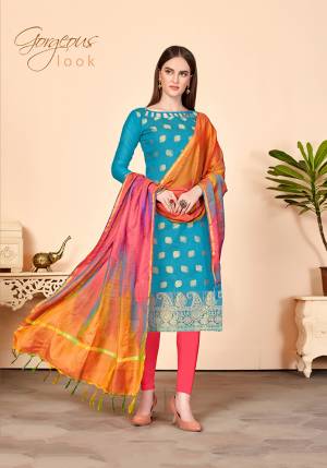 Look Beautiful In This Simple And Elegant Looking Dress Material In Blue Colored Top Paired With Contrasting Pink Colored Bottom And Multi Colored Dupatta. Its Top Is Jacquard Silk Fabricated Paired With Cotton Bottom And Banarasi Art Silk Dupatta. 