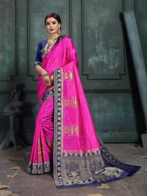 Look Pretty In This Designer Silk Based Saree Beautified With Weave All Over. Its Rich Fabric And Unique Weave Pattern Will Earn You Lots Of Compliments From Onlookers.