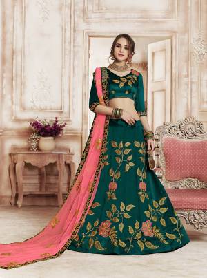 New And Unique Color Pallete Is Here With This Heavy Designer Lehenga Choli In Teal Blue Color Paired With Contrasting Pink Colored Dupatta. Its Contrasting Embroidery Will Give An Attractive Look. 