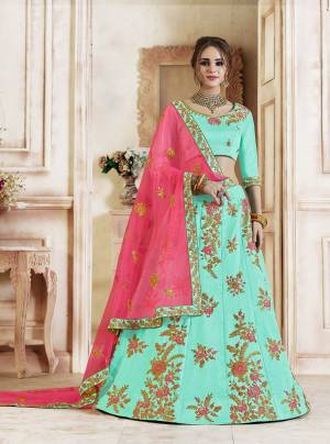Look Pretty In This Lovely Shades Wearing This Heavy Designer Lehenga Choli In Aqua Blue Color Paired With Contrasting Rani Pink Colored Dupatta. This Lehenga Choli Is Silk Based Paired With Net Fabricated Dupatta. Buy Now.