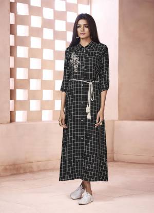 Checks Can Never Go Out Of Style, So Grab This Designer Readymade Kurti In Black Color Fabricated On Weaving Cotton Beautified With Checks Prints All Over And Thread Embroidered Butta. 