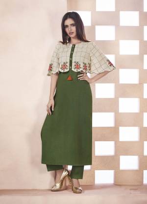 Very Beautiful Designer Piece Is Here With This Readymade Kurti In Olive Green And Cream Color Fabricated On Weaving Cotton. This Kurti Has Pretty Cape Pattern Beautified With Checks Prints And Thread Work. 