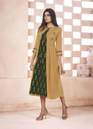 Celebrate This Festive Season With Ease And Comfort Wearing This Designer Readymade Kurti In Dark Green And Musturd Yellow Color Fabricated On Weaving Cotton. It Is Beautified With Ikkat Prints And Tread Work. 