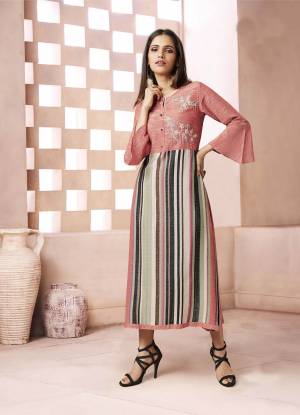 Here Is A Very Pretty Yoke Patterned Readymade Kurti In Peach And Multi Color Fabricated On Weaving Cotton. This Kurti Is Beautified With Prints And Thread Work. Buy Now.