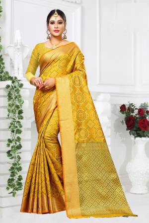 Celebrate This Festive Season Wearing This Designer Silk Based Saree In Yellow Color paired With Yellow And Green Colored Blouse. This Saree And Blouse Are Fabricated On Patola Art Silk Beautified with Weave All Over. 