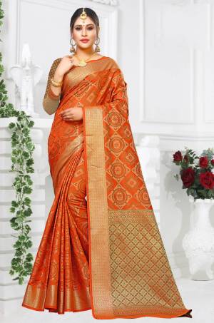 Pure Traditional Shade Is Here With This Designer Saree In Orange Color Paired With Orange And Green Colored Blouse. This Saree And Blouse Are Fabricated On Patola Art Silk Beautified with Weave All Over It. 