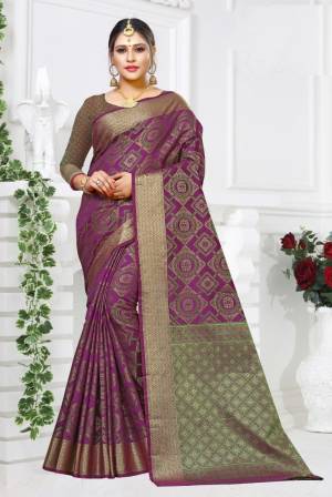 Celebrate This Festive Season Wearing This Designer Silk Based Saree In Purple Color paired With Purple And Green Colored Blouse. This Saree And Blouse Are Fabricated On Patola Art Silk Beautified with Weave All Over. 