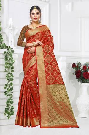 Pure Traditional Shade Is Here With This Designer Saree In Red Color Paired With Red And Green Colored Blouse. This Saree And Blouse Are Fabricated On Patola Art Silk Beautified with Weave All Over It. 