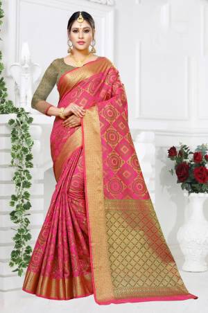 Celebrate This Festive Season Wearing This Designer Silk Based Saree In Fuschia Pink Color paired Fuschia Pink And Green Colored Blouse. This Saree And Blouse Are Fabricated On Patola Art Silk Beautified with Weave All Over. 