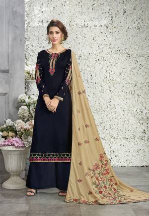 Enhance Your Personality Wearing This Designer Suit In Navy Blue Color Paired With Beige Colored Dupatta. Its Top Is Fabricated On Silk Georgette Paired With Santoon Bottom And Soft Silk Dupatta. Its Top And Dupatta Are Beautified With Contrasting Heavy Embroidery. 