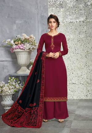 For A Royal Look, Grab This Attractive Designer Suit In Maroon Color Paired With Black Colored Dupatta. Its Top Is Fabricated On Silk Georgette Paired With Santoon Bottom And Soft Silk Fabricated Dupatta. All Its Fabrics Are Soft Towards Skin And Easy To Carry All Day Long. 