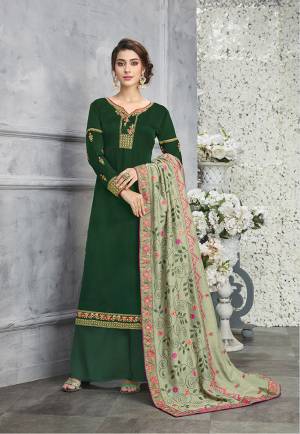 Go With The Shades Of Green With This Designer Suit In Green Colored Top And Bottom Paired With Pastel Green Colored Dupatta. Its Embroidered Top Is Fabricated On Silk Georgette Paired With Santoon Bottom And Embroidered Silk Based Dupatta. 