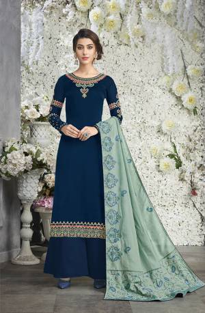 Go With The Shades Of Green With This Designer Suit In Blue Colored Top And Bottom Paired With Baby Blue Colored Dupatta. Its Embroidered Top Is Fabricated On Silk Georgette Paired With Santoon Bottom And Embroidered Silk Based Dupatta. 