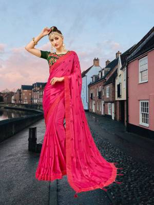 Catch All The Limelight Wearing This Designer Saree In Rani Pink Color Paired With Contrasting Dark Green Colored Blouse. This Saree Is Fabricated On Georgette Paired With Art Silk Fabricated Blouse. Buy Now.