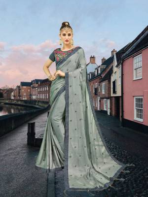 Flaunt Your Rich And Elegant Taste Wearing This Designer Saree In Steel Grey Color Paired With Grey Colored Blouse. This Saree Is Fabricated On Georgette Paired With Art Silk Fabricated Blouse. It Has Heavy Embroidered Blouse With Elegant Butti Embroidered Saree. 