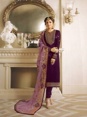 Bright And Visually Appealing Color Is Here With This Designer Straight Suit In Dark Purple Color Paired With Contrasting Lavendor Colored Dupatta. Its Top Is Satin Georgette Based Paired With Santoon Bottom And Net Fabricated Heavy Embroidered Dupatta. Its Color And Heavy Embroidery Will Give An Attractive Look To Your Personality. 