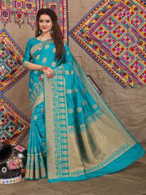 Celebrate This Festive Season With Beauty And Comfort Wearing This Designer Silk Based Saree In Turquoise Blue Color. This Saree Is Fabricated On Jacquard Silk Beautified With Attractive Weave Paired With Art Silk Fabricated Blouse. 
