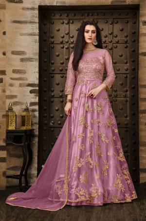 Grab This Very Pretty Deisgner Floor Length Suit In Pink Color Paired With Pink Colored Bottom And Dupatta. Its Heavy Embroidered Top Is Fabricated On Net Paired With Santoon Bottom And Net Fabrucated Dupatta Also It Comes With A Satin Fabricated Inner Which Gives An Olverall Attractive Look. Buy This Pretty Suit Now.