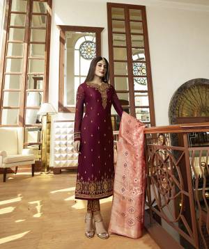 Catch All The Limelight Wearing This Heavy Designer Straight Suit In Magenta Pink Color Paired With Contrasting Peach Colored Dupatta. Its Top IS Fabricated On Satin Georgette Paired With Santoon Bottom And Jacquard Silk Fabricated Dupatta. Buy Now.