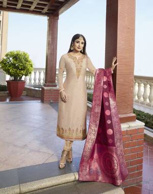 Simple And Elegant Looking Designer Straight Suit Is Here In Cream Color Paired With Dark Pink Colored Dupatta. Its Top Is Fabricated On Satin Georgette Paired With Santoon Bottom And Jacquard Silk Fabricated Dupatta. All Its Fabrics Ensures Superb Comfort All Day Long. 