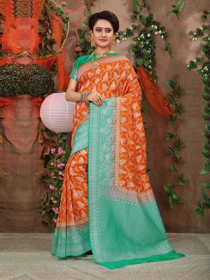 Look Pretty In This Designer Silk Based Saree Beautified With Weave All Over. Its Rich Fabric And Unique Weave Pattern Will Earn You Lots Of Compliments From Onlookers.