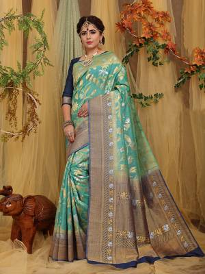 This Festive Season Look The Most Elegant Of All Wearing This Designer Silk based Saree Beautified With Weave. This Saree Is Light Weight, Durable And Easy To Carry Throuhout The Gala