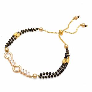 Grab This New And Trendy Mangalsutra Bracelet In Golden And Black Color. This Pretty Bracelet Can Be Paired With Any Kind Of Attire And Can Be Used As Daily Wear Instead Of Mangalsutra.