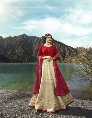Evegreen Traditional Color Pallete IS Here With Rhis Designer Floor Length Suit In Cream And Red Color Paired With Cream Colored Bottom And Maroon Colored Dupatta. Its Attractive Top Is Fabricated On Soft Silk Paired With Santoon Bottom And Embroidered Georgette Fabricated Dupatta. Buy Now.