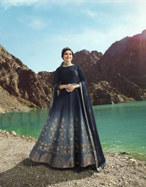 Enhance Your Personality In This Rich And Elegant Looking Designer Floor Length Suit In Navy Blue Color With A Graceful Shade Of Steel Grey Color. Its Top Is Fabricated On Soft Silk Paired With Santoon Bottom And Georgette Fabricated Dupatta. 