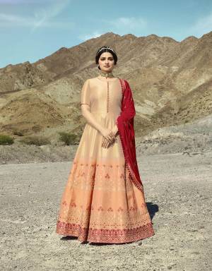 A Must Have Shade In Every Womens Wardrobe Is Here With This Designer Floor Length Suit In Light Peach Color Paired With Contrasting Red Colored Dupatta. Its Top Is Fabricated On Soft Silk Paired With Santoon Bottom And Attractive Red Colored Embroidered Dupatta. 