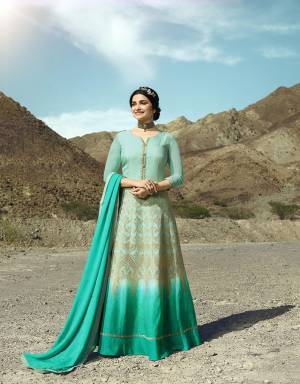 Subtle Shade For This Summer Is Here With This Heavy Designer Floor Length Suit In Aqua And Turquoise Blue Color Paired With Turquoise Blue Colored Bottom And Dupatta. Its Top Is Fabricated On Soft Silk Paired With Santoon Bottom And Georgette Fabricated Dupatta. 