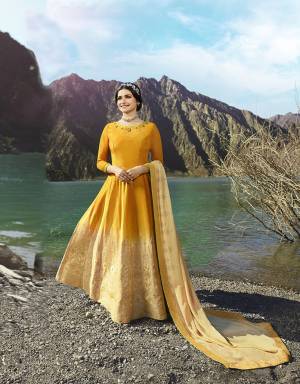 Celebrate This Festive Season With Beauty And Comfort Wearing This Designer Floor Length Suit In Musturd Yellow And Beige Color Paired With Beige Colored Bottom And Dupatta. Its Top IS Silk Based Paired With Santoon Bottom And Georgette Fabricated Dupatta. Buy Now.