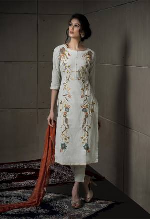 New Pastel Shade Is Here To Add Into Your Wardrobe For This Summer. Its Pretty Top And Bottom Are In Pale Grey Color Paired With Contrasting Rust Colored Dupatta. Its Attractive Embroidered Top Is Fabricated On Cotton Linen Paired With Cotton Bottom And Chiffon Fabricated Dupatta. Buy This Now.