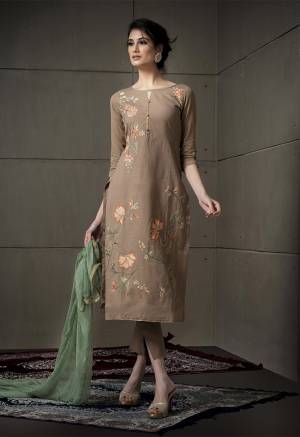 Celebrate This Festive Season With Beauty And Comfort Wearing This Designer Straight Suit In Light Brown Color Paired With Contrasting Mint Green Colored Dupatta. Its Embroidered Top Is Cotton Linen Based Paired With Cotton Bottom And Chiffon Fabricated Dupatta. Its Unique Color Combination And Attractive Embroidery Will Earn You Lots Of Compliments From Onlookers. 