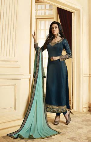 Go With The Pretty Shades Of Blue With This Designer Straight Cut Suit In Dark Teal Blue Color Paired With Contrasting Aqua Blue Colored Dupatta. Its Top Is Fabricated On Satin Georgette Paired With Santoon Bottom And Georgette Fabricated Dupatta. 