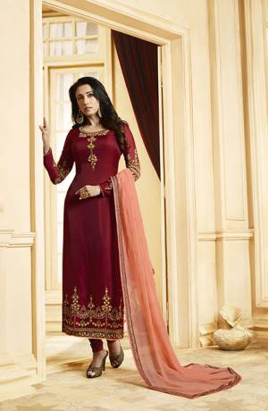 Royal And Elegant Looking Designer Straight Suit Is Here In Maroon Color Paired With Contrasting Peach Colored Dupatta. Its Embroidered Top Is Fabricated On Satin Georgette Paired With Santoon Bottom And Georgette Fabricated Dupatta. Buy Now.