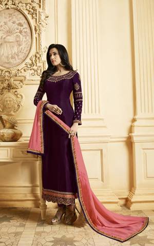 Look Pretty In This Lovely Color Pallete With This Designer Straight Cut Suit In Dark Purple Color Paired With Contrasting Pink Colored Dupatta. Its Top Is Fabricated On Satin Georgette Paired With Santoon Bottom And Georgette Fabricated Dupatta. It Is Beautified With Attractive Embroidery Over The Top. Buy Now.