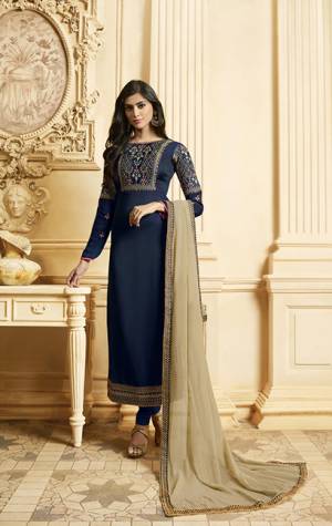 Enhance Your Personality Wearing This Designer Straight Cut Suit In Navy Blue Color Paired With Contrasting Beige Colored Dupatta.Its Attractive Embroidered Top Is Satin Georgette Based Paired With Santoon Bottom And Georgette Fabricated Dupatta. Buy This Designer Suit Now.