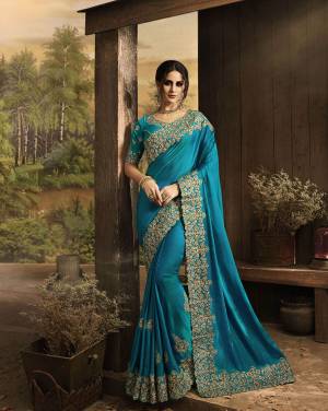 Add This Very Beautiful Evergreen Patterned Designer Saree In Blue Color Paired With Blue Colored Blouse. This Saree Is Fabricated On Soft Silk Paired With Art Silk Fabricated Blouse. It Has Heavy Embroidered Patch Border Over The Saree And Blouse With Embroidered Butti Patch Work. 