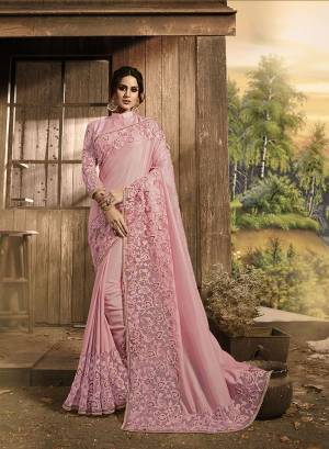 Look Pretty In This Beautiful Heavy Designer Saree In Baby Pink Color Paired With Baby Pink Colored Blouse. This Satee And Blouse are Fabricated On Satin Silk And Net Beautified With Heavy Fancy Embroidery Work. This Saree Is Light In Weight And Easy To Carry Throughout The Gala. 