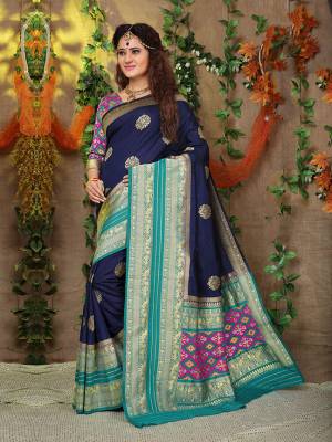 Look Pretty In This Designer Silk Based Saree Beautified With Weave All Over. Its Rich Fabric And Unique Weave Pattern Will Earn You Lots Of Compliments From Onlookers